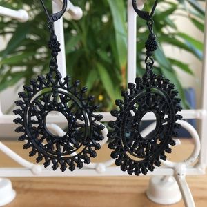 Black hoop type earrings